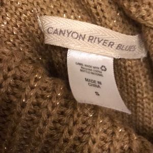 Gold Turtleneck Sweater.